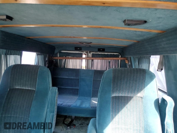 1994 Chevrolet Chevy Van z VIN 1GBEG25K1RF118547, wystawiony jako Copart lot #74319254 z przebiegiem 179 866 mil mil oraz Czysty tytuł • Clean title. Historia ofert i sprzedaży dostępna na DreamBid. Obrazek 10.
