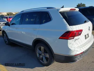 2018 Volkswagen Tiguan SEL Premium with VIN 3VV5B7AX2JM202908, listed as a IAAI auction lot 41137619 with 84,323 mi miles and . Bid and sale history available at DreamBid. Image 3.