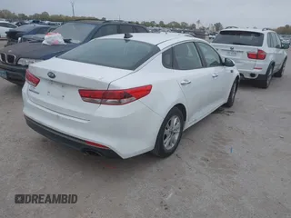 2016 Kia Optima LX with VIN KNAGT4L39G5104726, listed as a IAAI auction lot 40950914 with 128,728 mi miles. Bid and sale history available at carsss.com. Image 4.