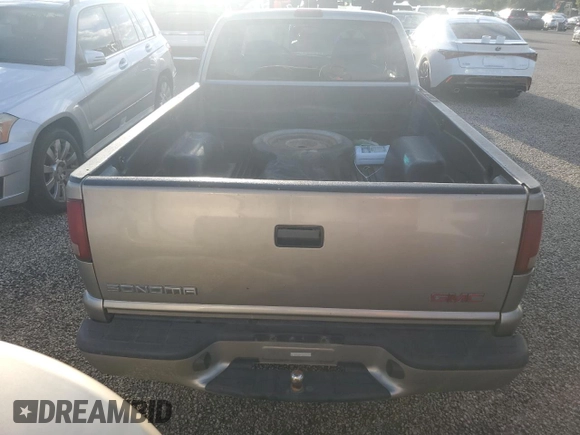 2000 GMC Sonoma SLS z VIN 1GTCS19W3Y8158978, wystawiony jako Copart lot #74180564 z przebiegiem Nie podano mil oraz Szkody całkowita. Historia ofert i sprzedaży dostępna na DreamBid. Obrazek 6.