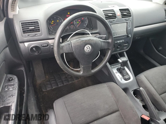 2009 Volkswagen Rabbit S with VIN WVWBB71K89W004528, listed as a Copart auction lot 80742174 with 122,926 mi miles and Salvage title. Bid and sale history available at DreamBid. Image 8.