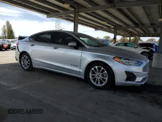 2019 Ford Fusion Hybrid SE with VIN 3FA6P0LU7KR262160, listed as a Copart auction lot 51969555 with 99,699 mi miles and Salvage Title. Bid and sale history available at carsss.com. Image 4.