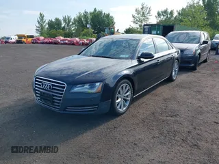 2011 Audi A8 with VIN WAURVAFD4BN018884, listed as a IAAI auction lot 42693000 with 116,952 mi miles and . Bid and sale history available at DreamBid. Image 2.