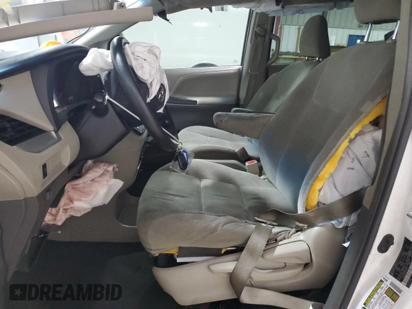 2016 Toyota Sienna L with VIN 5TDZK3DC2GS735352, listed as a Copart auction lot 77198404 with 224,495 mi miles and Salvage title. Bid and sale history available at DreamBid. Image 7.