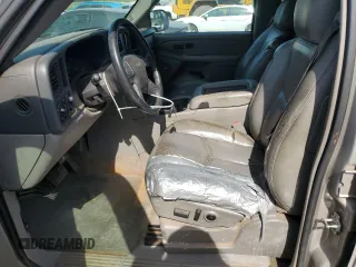 2005 GMC Yukon SLE z VIN 1GKEC13T75J179930, wystawiony jako Copart lot #57259205 z przebiegiem 310 454 mil mil oraz Szkody całkowita. Historia ofert i sprzedaży dostępna na DreamBid. Obrazek 7.