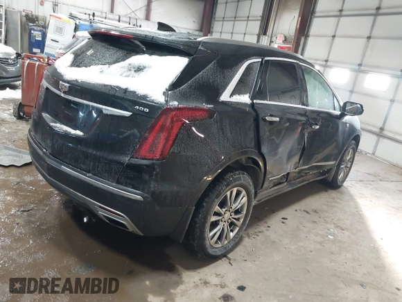 2021 Cadillac XT5 FWD Premium Luxury with VIN 1GYKNCRS3MZ198651, listed as a IAAI auction lot 41607734 with 49,275 mi miles. Bid and sale history available at carsss.com. Image 4.