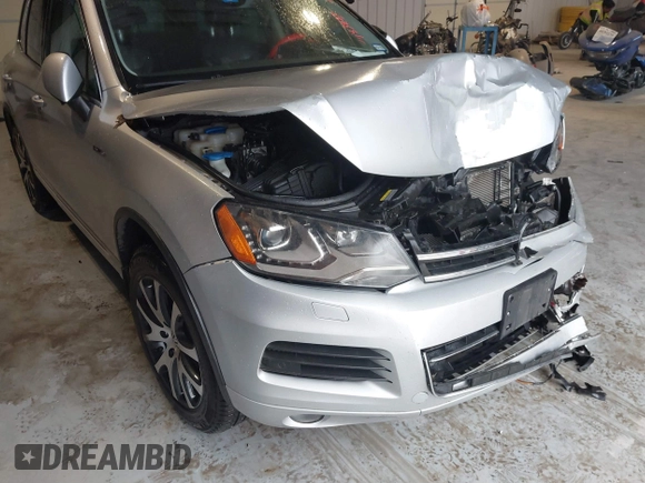 2011 Volkswagen Touareg Exec with VIN WVGFK9BP4BD005986, listed as a IAAI auction lot 41183877 with 109,005 mi miles and . Bid and sale history available at DreamBid. Image 6.