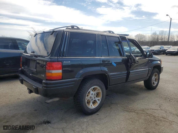 1998 Jeep Grand Cherokee Limited with VIN 1J4GZ78Y0WC140588, listed as a Copart auction lot 49522445 with 62,195 mi miles and Salvage Title. Bid and sale history available at carsss.com. Image 3.