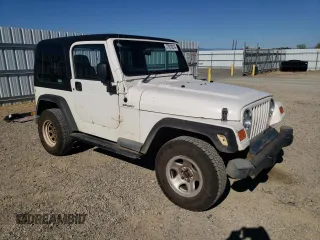 2006 Jeep Wrangler Sport Right Hand Drive with VIN 1J4F449S76P747454, listed as a Copart auction lot 77819214 with 184,763 mi miles and Salvage Title. Bid and sale history available at carsss.com. Image 4.