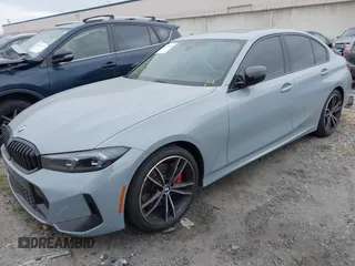 2024 BMW 3 Series 330i with VIN 3MW69FF04R8E41348, listed as a IAAI auction lot 42020955 with 23,395 mi miles. Bid and sale history available at carsss.com. Image 2.