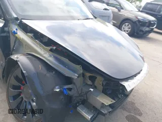 2023 Tesla Model Y Performance z VIN 7SAYGDEFXPF767971, wystawiony jako IAAI lot #42198881 z przebiegiem 32 442 mil mil oraz . Historia ofert i sprzedaży dostępna na DreamBid. Obrazek 23.