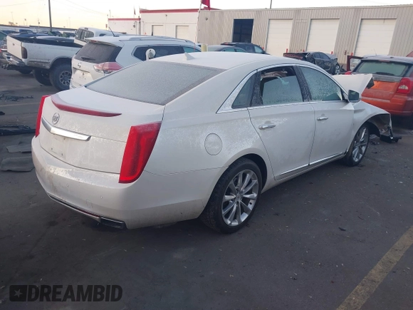 2014 Cadillac XTS Premium with VIN 2G61P5S30E9123057, listed as a IAAI auction lot 41301457 with 123,042 mi miles and . Bid and sale history available at DreamBid. Image 4.