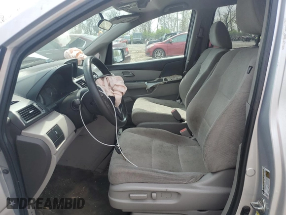 2013 Honda Odyssey LX z VIN 5FNRL5H28DB085114, wystawiony jako Copart lot #52942495 z przebiegiem 158 191 mil mil oraz Szkoda całkowita • Salvage title. Historia ofert i sprzedaży dostępna na DreamBid. Obrazek 7.
