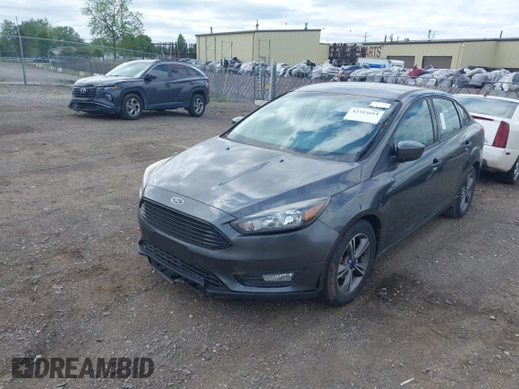 2018 Ford Focus SE z VIN 1FADP3FE5JL228583, wystawiony jako IAAI lot #42313614 z przebiegiem 84 240 mil mil oraz . Historia ofert i sprzedaży dostępna na DreamBid. Obrazek 17.
