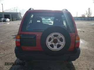 2003 Chevrolet Tracker z VIN 2CNBE13CX36943395, wystawiony jako Copart lot #70964574 z przebiegiem 118 975 mil mil oraz Szkody całkowita. Historia ofert i sprzedaży dostępna na DreamBid. Obrazek 6.