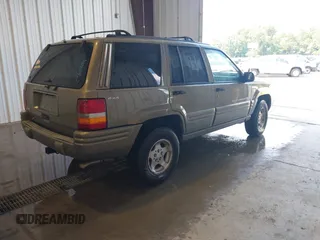 1998 Jeep Grand Cherokee Laredo with VIN 1J4GZ48S4WC262249, listed as a IAAI auction lot 42739473 with 94,094 mi miles and . Bid and sale history available at DreamBid. Image 4.