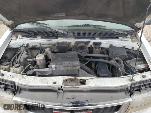 2000 GMC Safari z VIN 1GDDM19W3YB518506, wystawiony jako Copart lot #80923314 z przebiegiem 303 166 mil mil oraz Szkody całkowita. Historia ofert i sprzedaży dostępna na DreamBid. Obrazek 11.