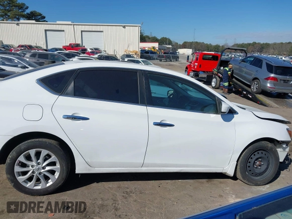 2019 Nissan Sentra S z VIN 3N1AB7AP4KY265082, wystawiony jako IAAI lot #41642989 z przebiegiem 75 937 mil mil oraz . Historia ofert i sprzedaży dostępna na DreamBid. Obrazek 13.