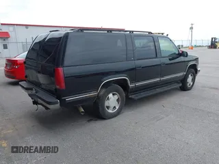 1999 Chevrolet Suburban with VIN 3GNFK16R4XG232727, listed as a IAAI auction lot 42602810 with 121,395 mi miles and . Bid and sale history available at DreamBid. Image 4.