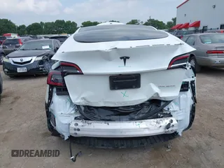 2023 Tesla Model Y Long Range with VIN 7SAYGAEEXPF776370, listed as a IAAI auction lot 42127512 with 27,120 mi miles and . Bid and sale history available at DreamBid. Image 6.