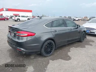 2018 Ford Fusion Titanium z VIN 3FA6P0K9XJR160993, wystawiony jako IAAI lot #41938148 z przebiegiem 137 410 mil mil oraz . Historia ofert i sprzedaży dostępna na DreamBid. Obrazek 4.