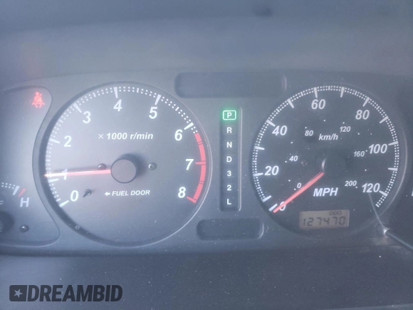 2002 Isuzu Rodeo S with VIN 4S2DM58W824313096, listed as a Copart auction lot 77951364 with 127,470 mi miles and Salvage Title. Bid and sale history available at DreamBid. Image 9.
