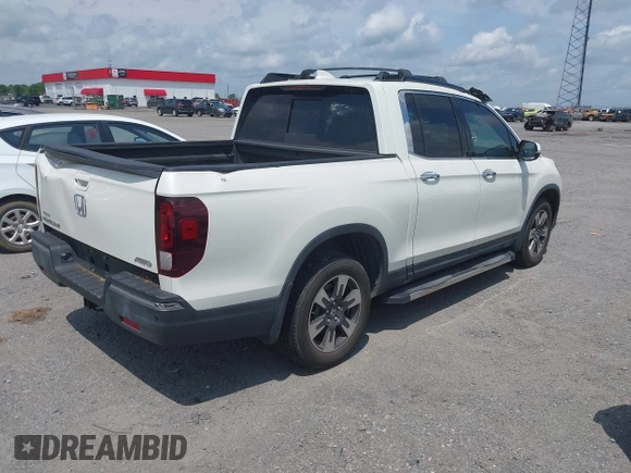 2019 Honda Ridgeline RTL-E with VIN 5FPYK3F77KB021667, listed as a IAAI auction lot 42115019 with 87,221 mi miles and . Bid and sale history available at DreamBid. Image 4.