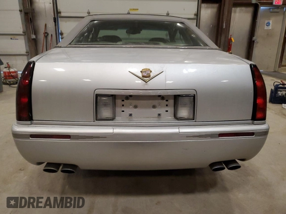 2000 Cadillac Eldorado Touring ETC z VIN 1G6ET1294YU180525, wystawiony jako Copart lot #89253455 z przebiegiem 102 230 mil mil oraz Nie do naprawy • Non repairable. Historia ofert i sprzedaży dostępna na DreamBid. Obrazek 6.