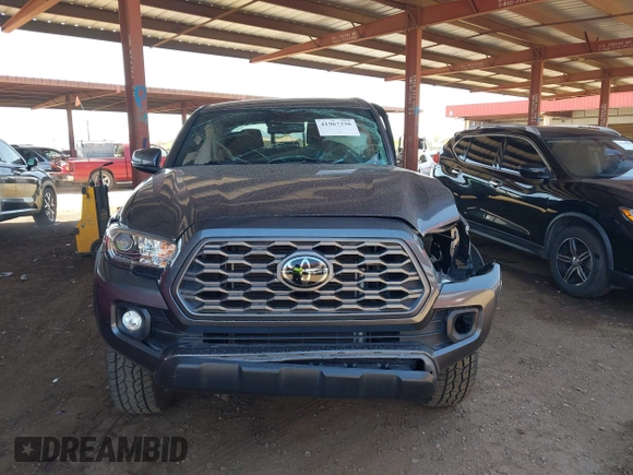 2022 Toyota Tacoma SR z VIN 3TYCZ5AN1NT062445, wystawiony jako IAAI lot #41967336 z przebiegiem Nie podano mil oraz . Historia ofert i sprzedaży dostępna na DreamBid. Obrazek 12.
