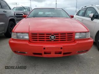 2002 Cadillac Eldorado z VIN 1G6EC129X2B106142, wystawiony jako Copart lot #74424164 z przebiegiem Nie podano mil oraz Szkody całkowita. Historia ofert i sprzedaży dostępna na DreamBid. Obrazek 5.