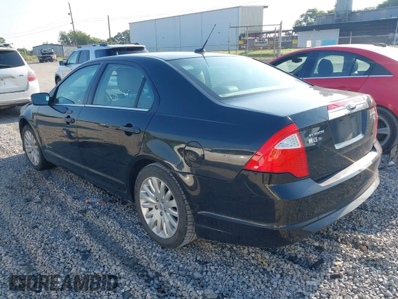 2012 Ford Fusion Hybrid z VIN 3FADP0L35CR371734, wystawiony jako IAAI lot #42559033 z przebiegiem 131 314 mil mil oraz . Historia ofert i sprzedaży dostępna na DreamBid. Obrazek 3.