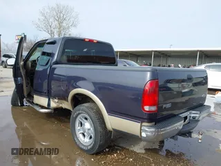 2000 Ford F-150 XL with VIN 1FTRX17L2YNB85627, listed as a IAAI auction lot 41377814 with 123,740 mi miles. Bid and sale history available at carsss.com. Image 3.