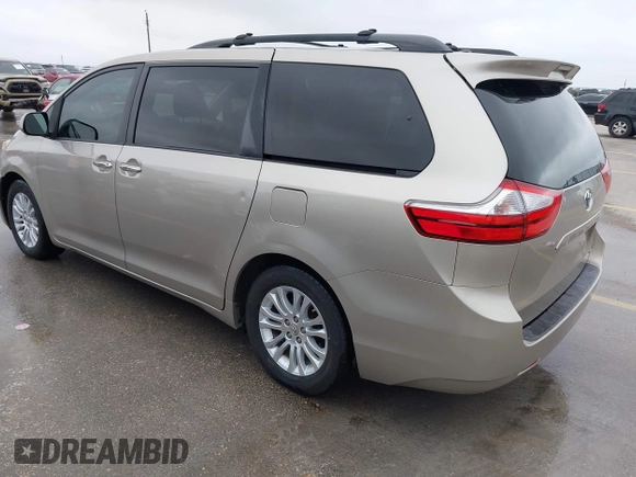 2015 Toyota Sienna XLE with VIN 5TDYK3DCXFS578888, listed as a IAAI auction lot 42187384 with 105,287 mi miles and . Bid and sale history available at DreamBid. Image 3.