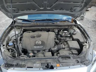 2018 Mazda 3 Touring z VIN 3MZBN1L30JM164074, wystawiony jako Copart lot #56741745 z przebiegiem 86 812 mil mil oraz Szkoda całkowita • Salvage title. Historia ofert i sprzedaży dostępna na DreamBid. Obrazek 11.