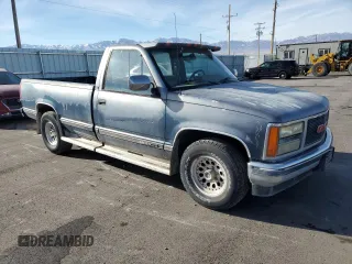 1990 GMC Sierra 1500 with VIN 1GTFC24K2LE554012, listed as a Copart auction lot 86004084 with 174,771 mi miles and Clean Title. Bid and sale history available at DreamBid. Image 4.
