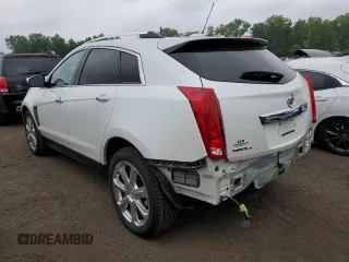 2015 Cadillac SRX Premium Collection with VIN 3GYFNGE32FS528514, listed as a Copart auction lot 61222534 with 104,433 mi miles and Salvage Title. Bid and sale history available at carsss.com. Image 2.