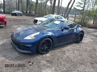 2014 Nissan 370Z Nismo z VIN JN1AZ4EH0EM631950, wystawiony jako IAAI lot #41685567 z przebiegiem 103 282 mil mil oraz . Historia ofert i sprzedaży dostępna na DreamBid. Obrazek 17.