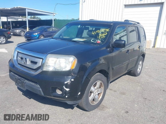 2009 Honda Pilot EX-L with VIN 5FNYF48599B023705, listed as a IAAI auction lot 41904286 with 142,140 mi miles. Bid and sale history available at carsss.com. Image 2.