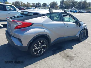 2019 Toyota C-HR XLE with VIN JTNKHMBX8K1046347, listed as a IAAI auction lot 42140743 with 49,918 mi miles and . Bid and sale history available at DreamBid. Image 4.