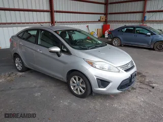2013 Ford Fiesta SE with VIN 3FADP4BJ3DM173949, listed as a IAAI auction lot 40494276 with 141,061 mi miles. Bid and sale history available at carsss.com. Image 1.