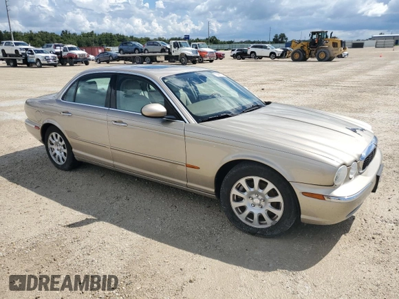 2004 Jaguar XJ with VIN SAJWA71C24SG28164, listed as a Copart auction lot 73968134 with 0 mi miles and Salvage Title. Bid and sale history available at carsss.com. Image 4.