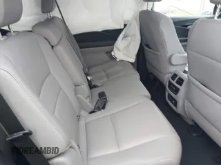2017 Honda Pilot Touring with VIN 5FNYF6H90HB052474, listed as a IAAI auction lot 42291464 with 103,288 mi miles and . Bid and sale history available at DreamBid. Image 8.