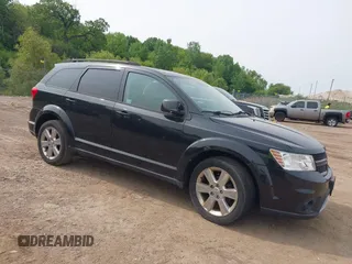 2012 Dodge Journey SXT z VIN 3C4PDCBG9CT164501, wystawiony jako IAAI lot #42421361 z przebiegiem 146 505 mil mil oraz . Historia ofert i sprzedaży dostępna na DreamBid. Obrazek 1.