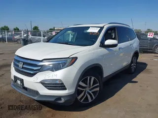 2018 Honda Pilot Touring with VIN 5FNYF6H95JB019122, listed as a IAAI auction lot 42439283 with 128,848 mi miles and . Bid and sale history available at DreamBid. Image 2.