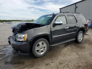 2010 Chevrolet Tahoe LTZ z VIN 1GNUCCE08AR150879, wystawiony jako Copart lot #53975795 z przebiegiem 105 370 mil mil oraz Szkoda całkowita • Salvage title. Historia ofert i sprzedaży dostępna na DreamBid. Obrazek 1.