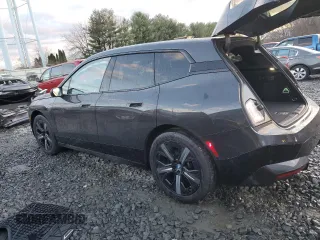 2022 BMW iX xDrive50 with VIN WB523CF05NCK62929, listed as a Copart auction lot 83295544 with 24,299 mi miles and Salvage Title. Bid and sale history available at carsss.com. Image 2.