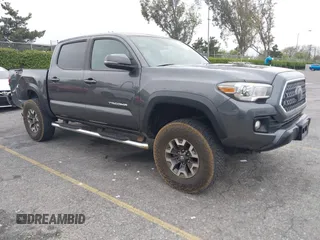 2018 Toyota Tacoma SR5 with VIN 3TMAZ5CN1JM071396, listed as a IAAI auction lot 42061640 with 122,148 mi miles and . Bid and sale history available at DreamBid. Image 1.