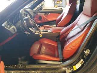 2015 BMW Z4 sDrive35i with VIN WBALM7C52FJ799104, listed as a Copart auction lot 88354535 with 56,560 mi miles and Salvage Title. Bid and sale history available at carsss.com. Image 7.