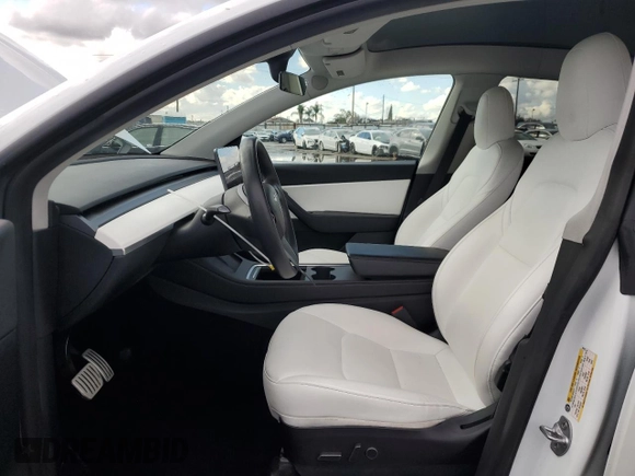 2021 Tesla Model Y Performance with VIN 5YJYGDEF4MF201815, listed as a Copart auction lot 42453075 with 76,888 mi miles and Salvage Title. Bid and sale history available at DreamBid. Image 7.