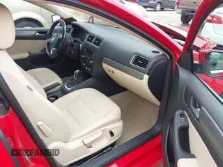2014 Volkswagen Jetta TDI w/Premium/Nav with VIN 3VWLL7AJ4EM383351, listed as a IAAI auction lot 42424074 with 66,824 mi miles and . Bid and sale history available at DreamBid. Image 5.